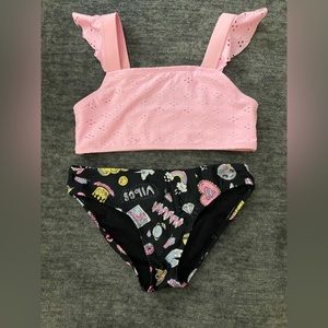 Cat and Jacks pink top with ruffles paired with The Children’s Place bottoms.